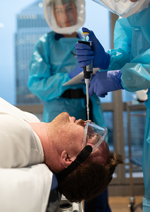 healthcare researchers conducting a human challenge trial