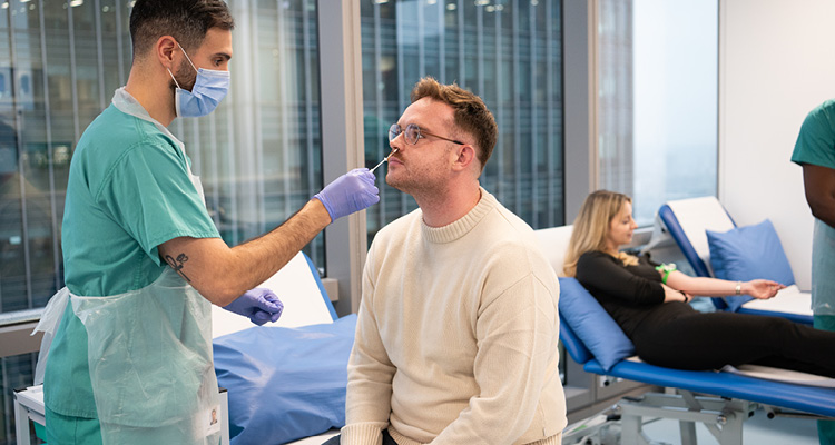 a clinical setting where healthcare professionals are conducting medical procedures.