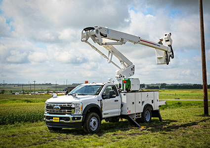 a white 2020 Ford F550 is equipped with a Terex aerial bucket device