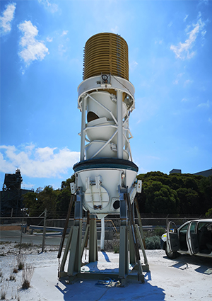 a Bruks Siwertell dry bulk ship unloader vertical conveyor module sitting on a support stand outdoors