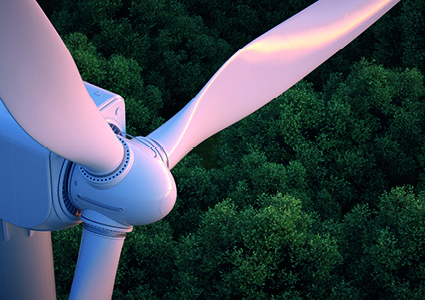 an elevated, close-up view of the rotor hub and blades of a modern commercial wind turbine
