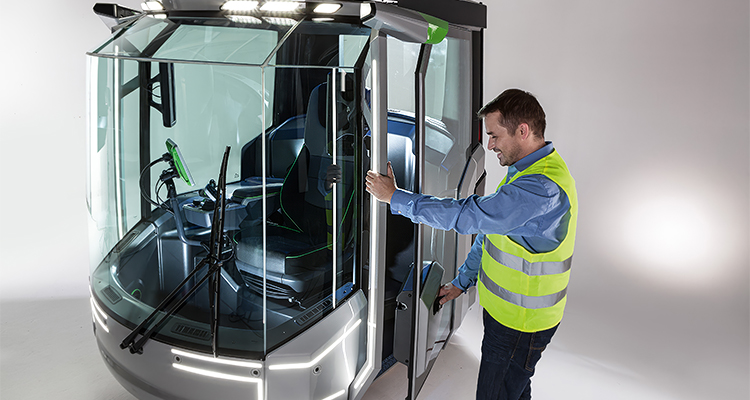 a man demonstrating the futuristic design of a high-tech vehicle cabin, known as the Genius CAB