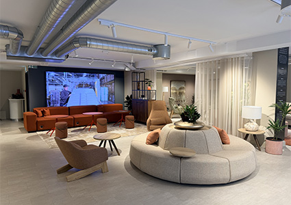 a modern corporate showroom or office breakout lounge area.
