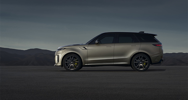 a full side-profile view of a modern Range Rover Sport SV luxury performance SUV parked on an expansive asphalt surface