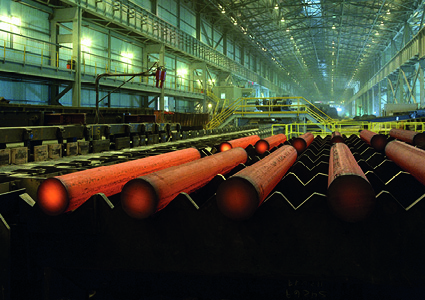 glowing, red-hot steel bars undergoing a process known as hot rolling