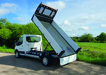 a Ford Transit Tipper truck, which features a specialized hydraulic rear-dumping bed widely used for construction, landscaping, and waste management