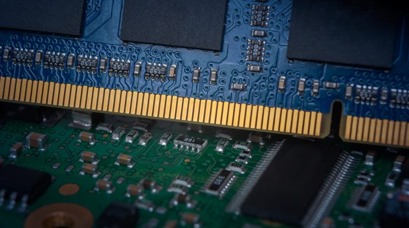 Close-up of DRAM memory chips mounted on a circuit board, illustrating the semiconductor supply chain and AI-driven demand for memory.