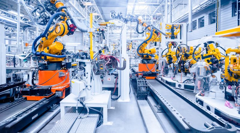 Robots arms and production line in advanced manufacturing operations inside a modern defense production facility.