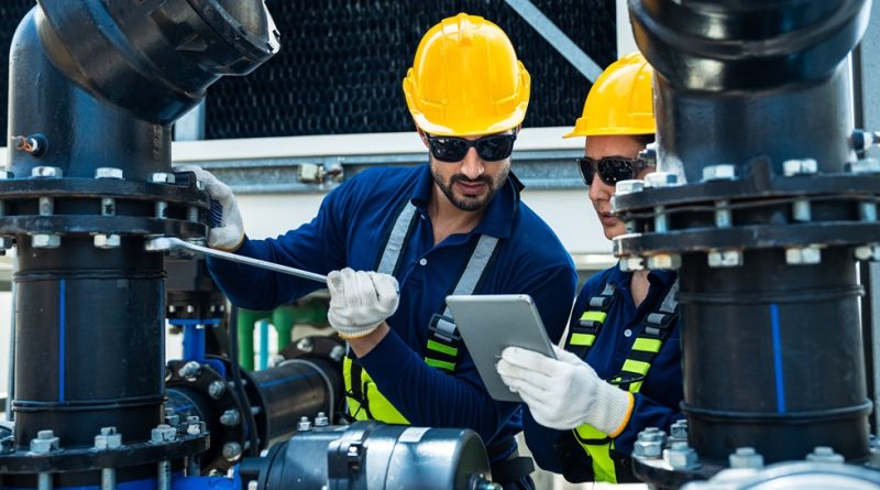 Two maintenance technicians with iPad