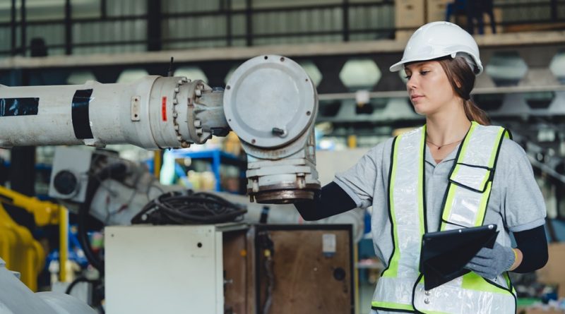 Maintenance engineer studying tablet