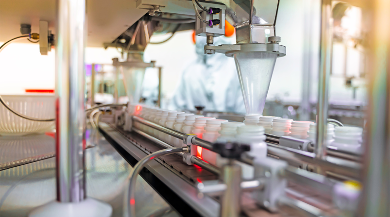 Transfer medicine bottles on the conveyor belt in the pharmaceutical industry