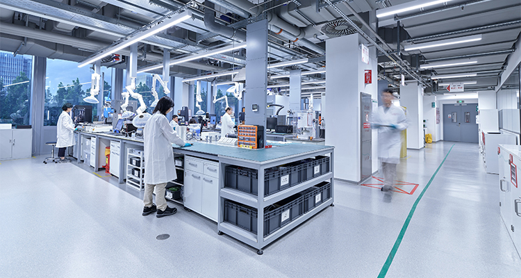 the interior of a modern, highly organized industrial laboratory or research facility
