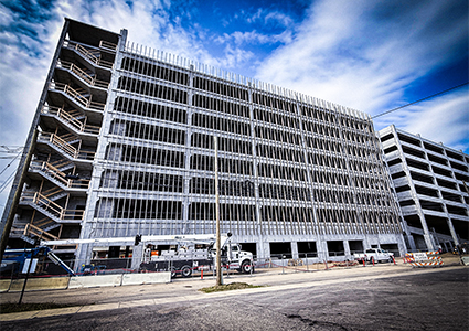 a large multi-story parking garage structure under construction