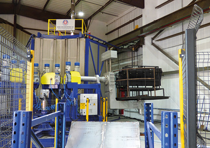 an industrial rotational moulding machine inside a factory