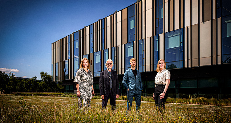 members of the family leadership team in front of the international headquarters for Romo Fabrics