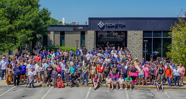 employees of Tech-Etch gathered outside their facility to celebrate the company's 60th anniversary