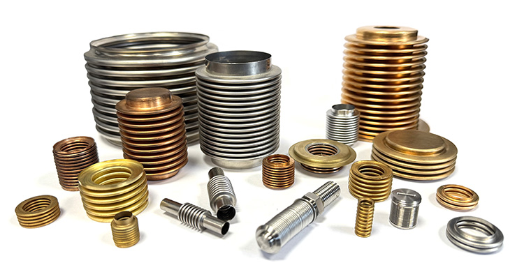 a collection of precision metal bellows and related components